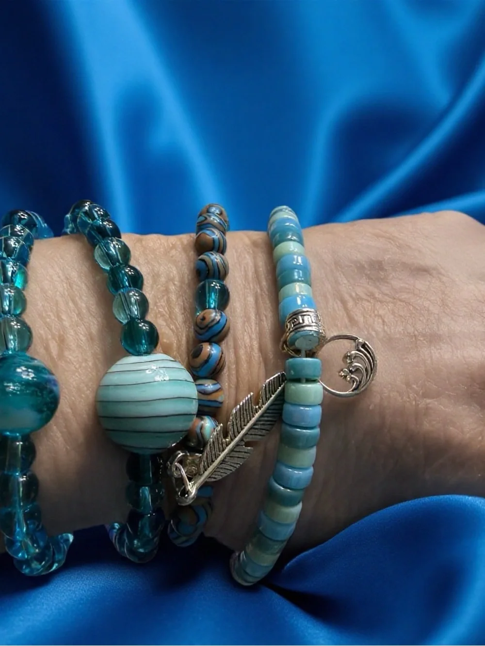 Hand Crafted Turquoise and Aqua Beaded Bracelet Set with Feather Charm
